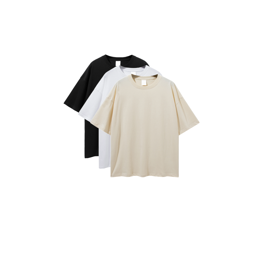 Three oversized deep drop shoulder t-shirts in black, white, and beige colors, displayed in a stacked arrangement.